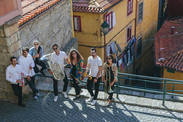 Portrait of Musician band staying together outdoor on European  city street - Fotografie, Obrázek