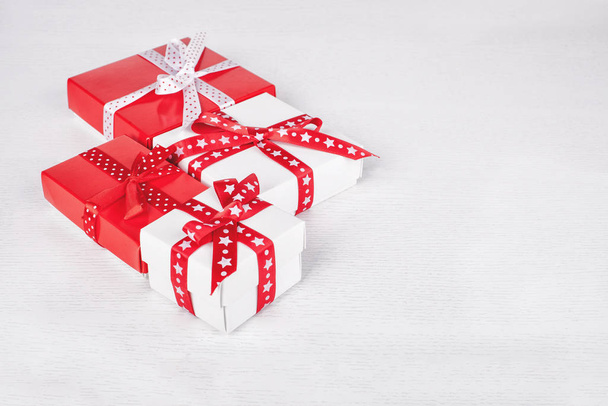 present boxes with ribbons on white background - Foto, Imagen
