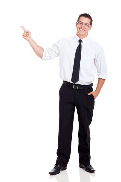 Young businessman pointing at copy space - Foto, Imagem