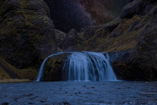 Milkyway at a waterfall in Iceland - Photo, Image
