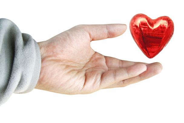 Рука тримає червоне серце
 - Фото, зображення