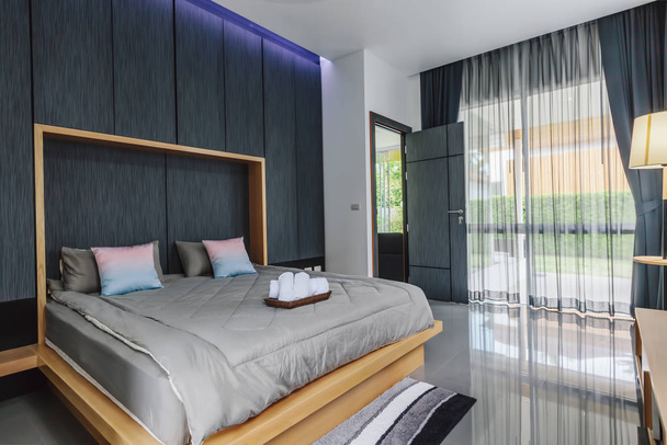 Modern bed room interior in Luxury villa. Big window - Фото, изображение