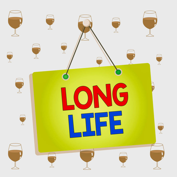 Text sign showing Long Life. Conceptual photo able to continue working for longer than others of the same kind Colored memo reminder empty board blank space attach background rectangle. - Photo, Image