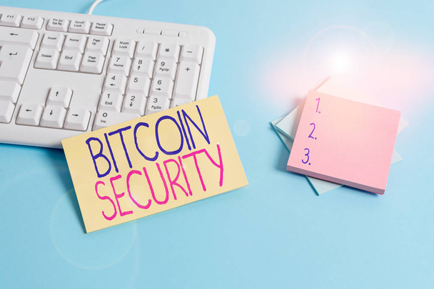 Text sign showing Bitcoin Security. Conceptual photo funds are locked in a public key cryptography system Paper blue desk computer keyboard office study notebook chart numbers memo. - Photo, Image