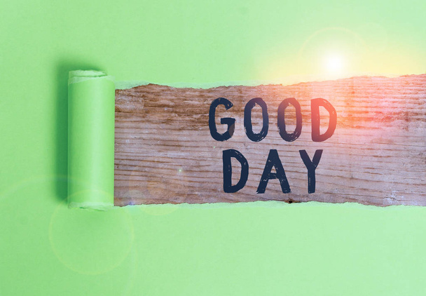 Word writing text Good Day. Business concept for Enjoying the moment with great weather Having lots of fun Cardboard which is torn in the middle placed above a wooden classic table. - Foto, imagen