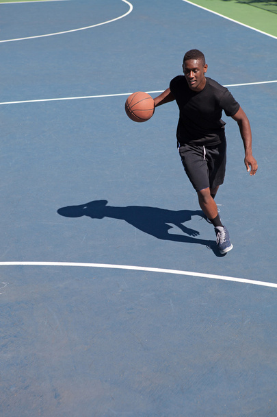 Basketball Player Dribbling - 写真・画像
