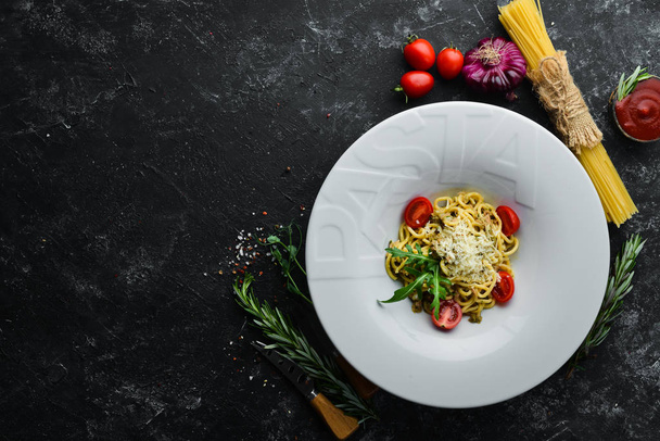 Italian traditional pasta with tuna and cherry tomatoes. Top view. Free copy space. - Zdjęcie, obraz