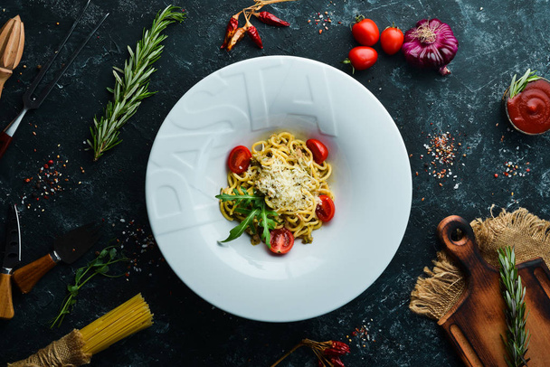 Italian traditional pasta with tuna and cherry tomatoes. Top view. Free copy space. - Zdjęcie, obraz
