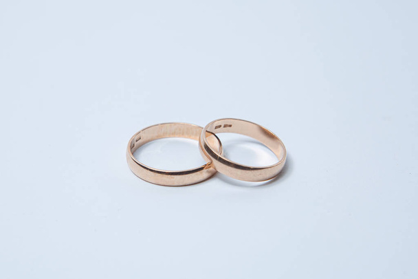 Two wedding rings on a white background - Fotó, kép