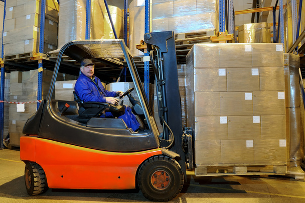 Forklift loader worker at warehouse - Fotografie, Obrázek