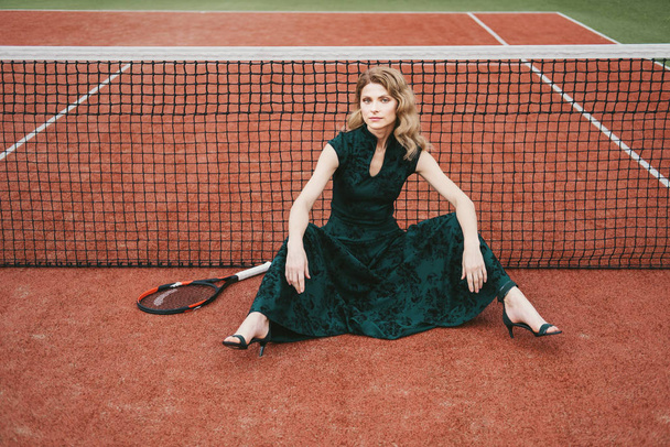 Luxury glamour fashion woman on tennis court holding racket and posing like model - Foto, Imagen