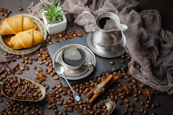 Black coffee beans on an old background - Fotó, kép