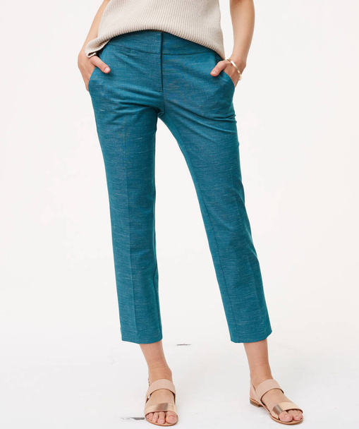 Sea green pants for women’s paired with flat footwear and white background - Fotó, kép