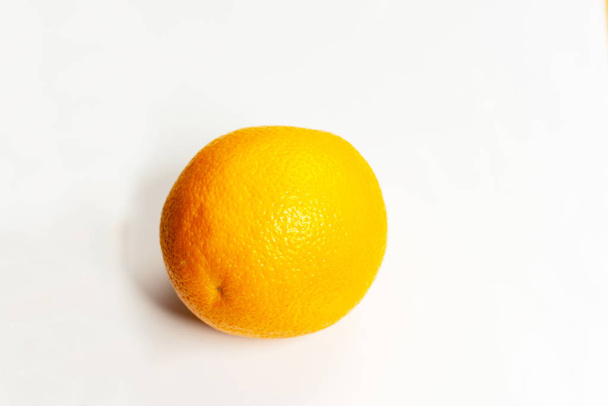 Ripe juicy and fresh orange on a white background. - Valokuva, kuva
