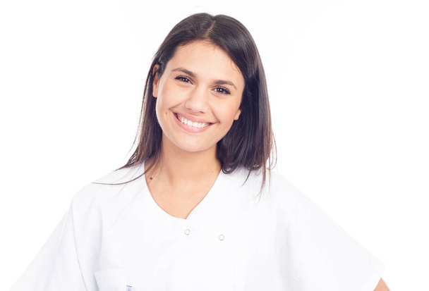 portrait of smiling nurse or brunette doctor in white coat - Zdjęcie, obraz