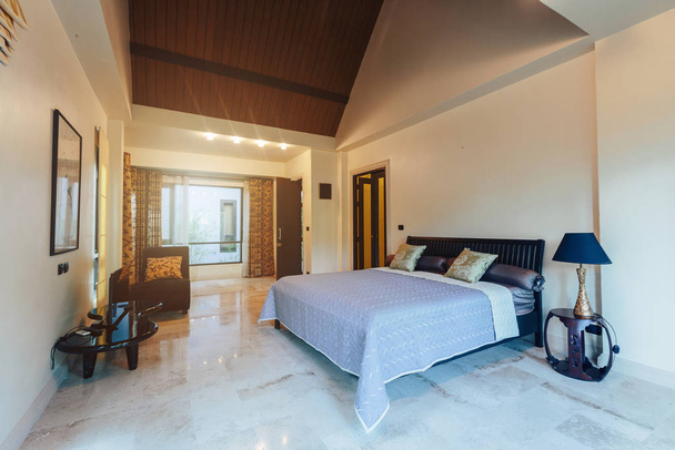 Modern bed room interior in Luxury villa. Big window, light space, marble floor - Фото, изображение