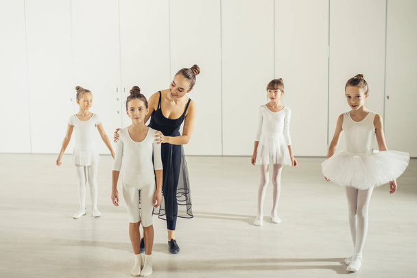 A group of little ballerinas with their graceful teacher - Fotoğraf, Görsel