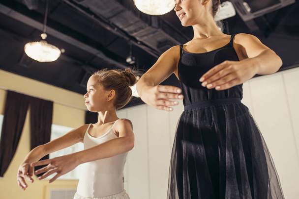 teacher ballerina teacher and kid girl beginner - Fotó, kép