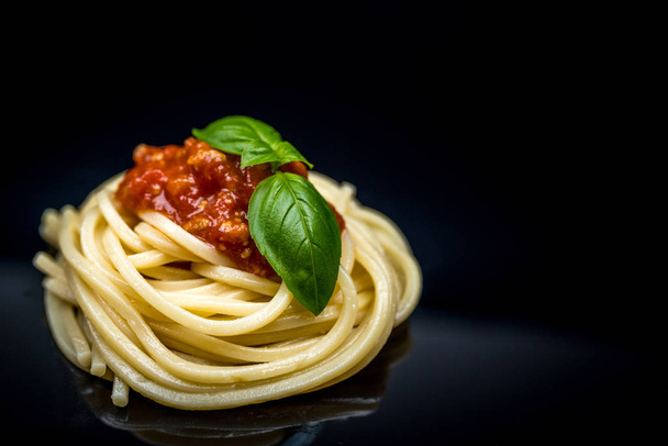 Italian spaghetti on black - Fotó, kép