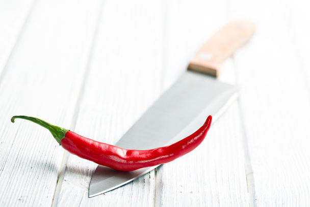 chili pepper on knife - Foto, immagini