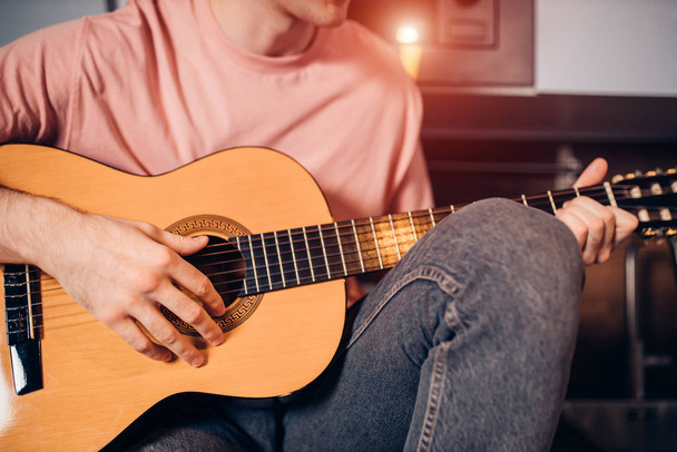 closeup of unrecognizable man playing the guitar - Фото, изображение