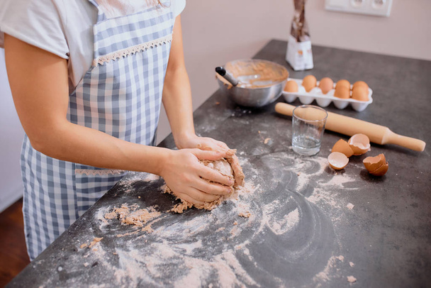 close-up of female hands making dough - Foto, Imagen