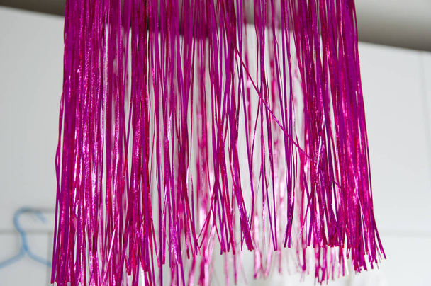 bright pink tinsel fextive christmas deco. merry christmas and happy new year. christmas tree decoration. xmas time. retro new year tree decor. vintage decoration. decor shop - Photo, Image