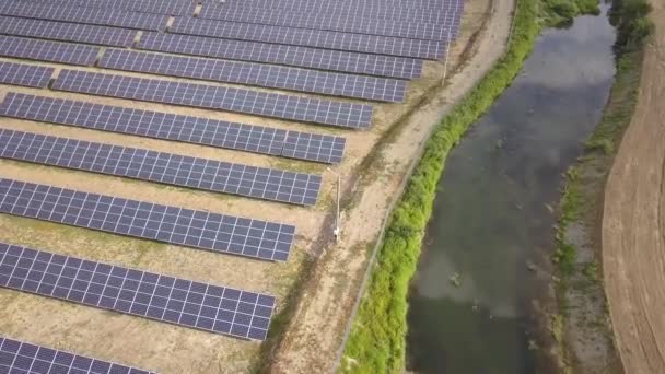 Aerial view of solar power plant. Electric panels for producing clean ecologic energy. - Metraje, vídeo