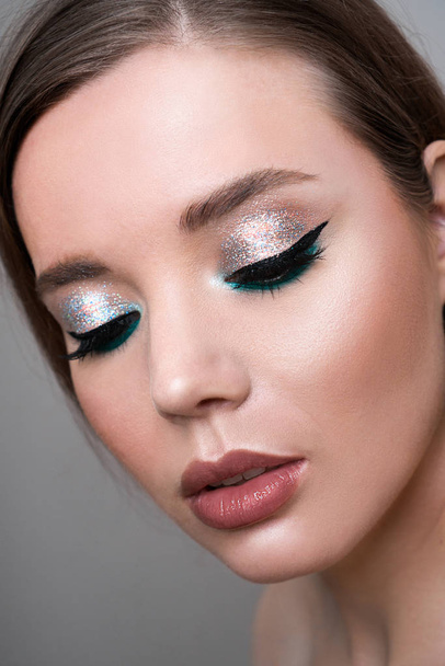 Close up of fashion model young woman in trendy make-up. - Valokuva, kuva