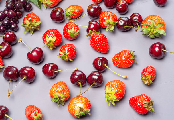 Mixed fruits and berries. Strawberries and cherries. - Fotó, kép