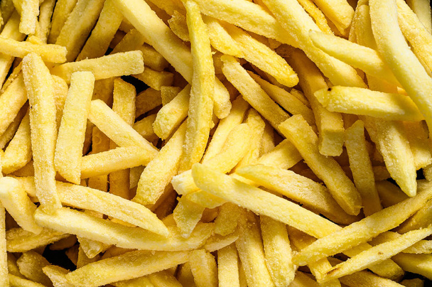 French fries in a frying pan. Gray background. Top view - Photo, Image
