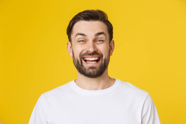 Young casual man portrait isolated on yellow background - Foto, imagen