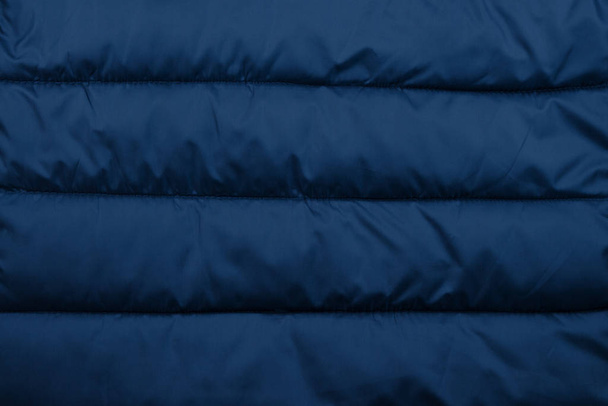 Texture de veste soufflante bleue. Doudoune tissu fond
. - Photo, image