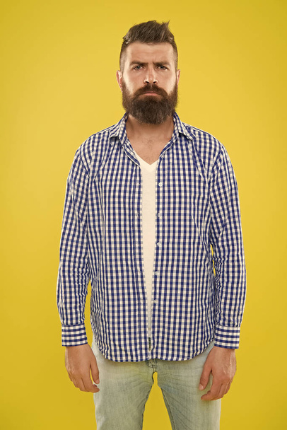 Mature upset man. Male fashion and spring style. Brutal bearded hipster in checkered shirt. Summer hipster. sad man with beard on yellow background. brutal man feel upset. sad and hopeless guy - Photo, image