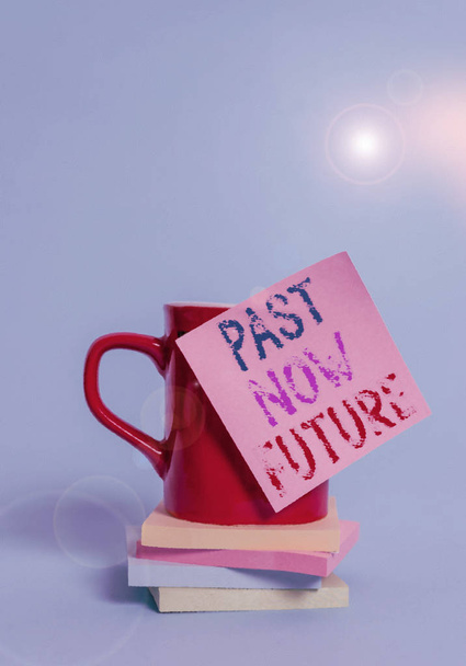 Conceptual hand writing showing Past Now Future. Business photo showcasing Last time Present Following actions Destiny Memories Coffee cup colored sticky note stacked pads plain background. - Photo, Image