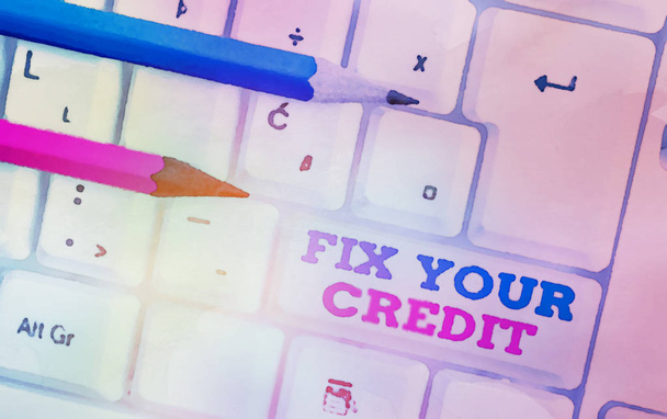 Writing note showing Fix Your Credit. Business photo showcasing Keep balances low on credit cards and other credit White pc keyboard with note paper above the white background. - Photo, Image