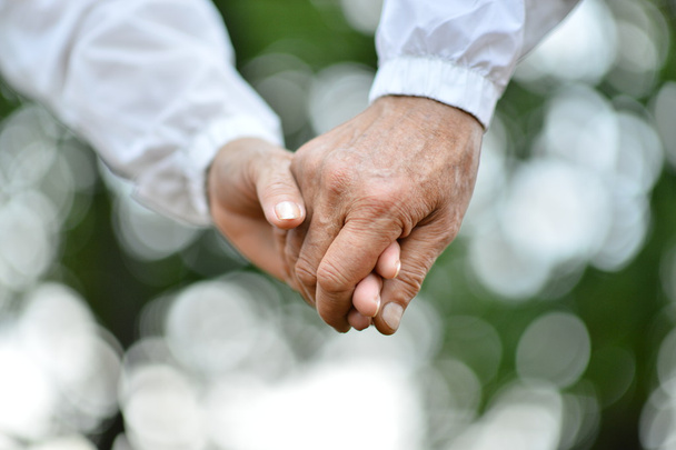 Two hands over nature - Фото, изображение