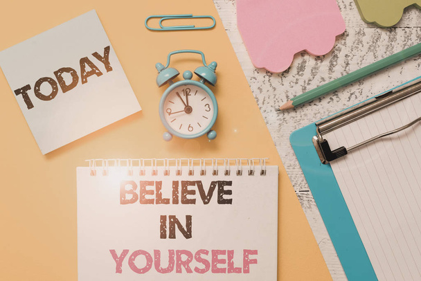 Word writing text Believe In Yourself. Business concept for common piece of advice that you can do everything Notepad clipboard clip sheet marker car sticks alarm clock wood background. - Foto, imagen