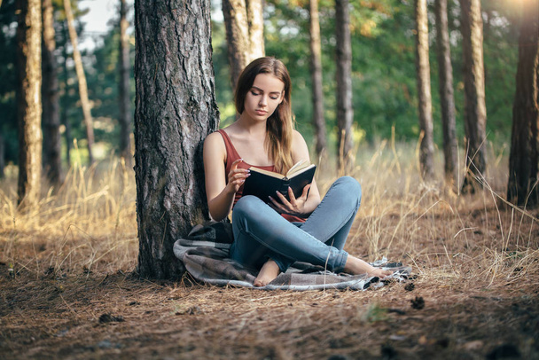 woman read in nature under tree - Photo, image