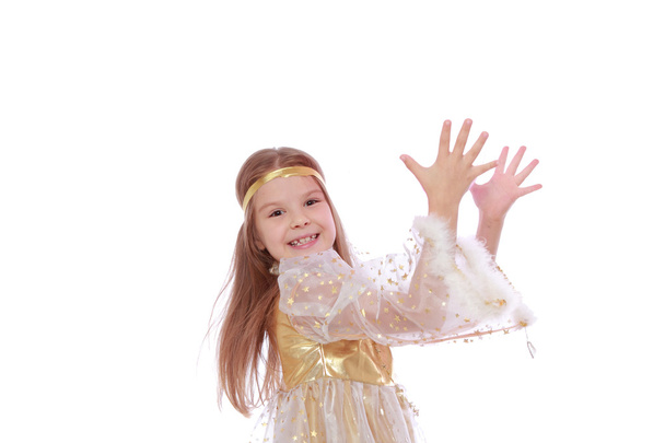 Girl with beautiful hair in a gold fancy dress - Фото, изображение