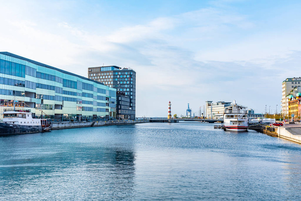 MALMO, SWEDEN, APRIL 24, 2019: Sunset view of waterfront in the  - Fotó, kép