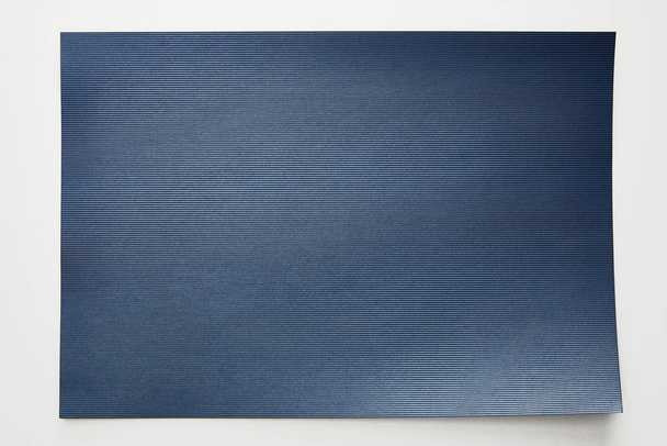 top view of striped empty blue paper on white background - Fotografie, Obrázek