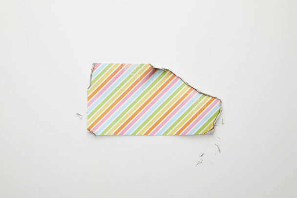 top view of empty burnt paper with colorful lines on white background - Fotó, kép