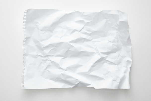 top view of empty crumpled paper on white background - Foto, Bild