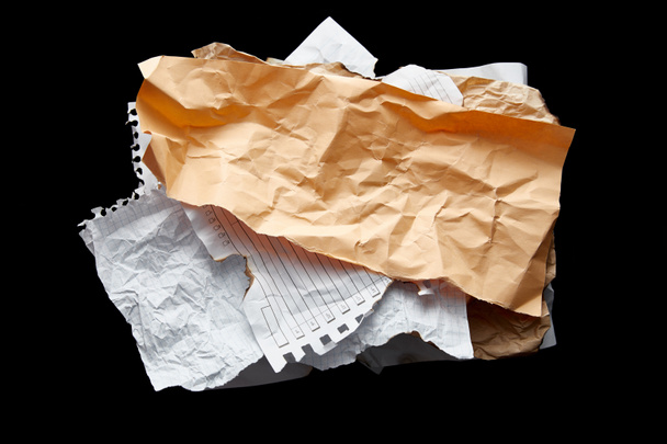 top view of empty crumpled papers isolated on black - Foto, Imagen