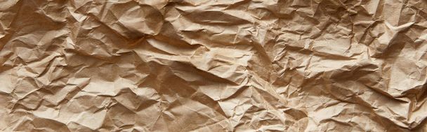 top view of empty beige crumpled craft paper texture, panoramic shot - Photo, Image