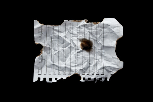 top view of empty white crumpled and burnt vintage paper isolated on black - Photo, Image
