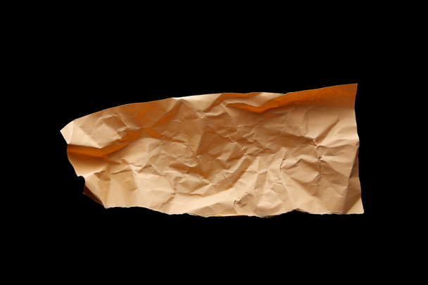 top view of empty crumpled paper isolated on black - Photo, Image