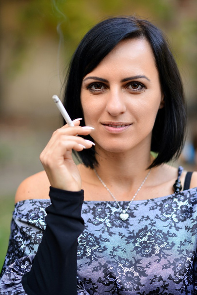 Beautiful lady with cigarette - Photo, Image