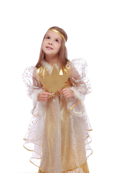 Little angel holding a gold star - Фото, изображение